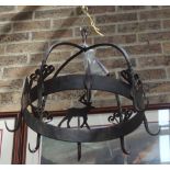A WROUGHT IRON HANGING PAN/UTENSIL RACK decorated with animals