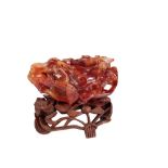 A LARGE CHINESE CARVED AGATE BRUSH WASHER, naturalistically carved in high relief with fruit and