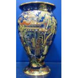 A BLUE GROUND CARLTONWARE VASE decorated with Oriental scenes, 20cm high