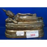 AN ASIAN BRONZE STUDY OF A RECLINING BUDDHA, 14.5cm long