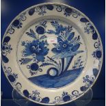 AN 18TH CENTURY BLUE AND WHITE TIN GLAZED DELFT CHARGER, 35.5cm dia. (examine)