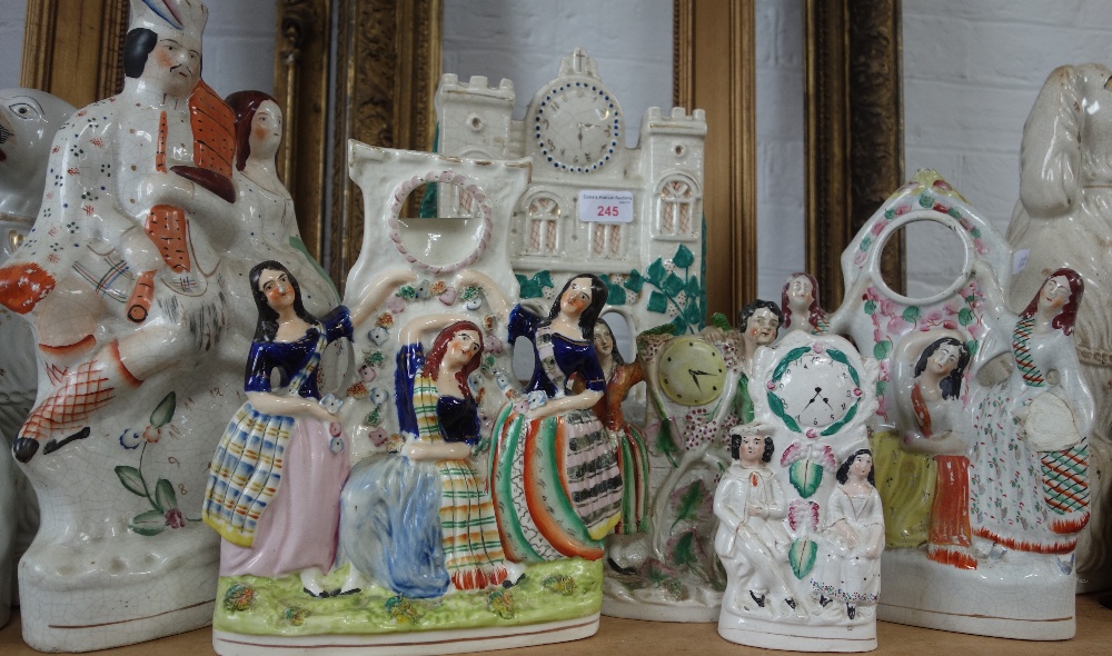 A COLLECTION OF STAFFORDSHIRE FLAT BACK FIGURES decorated with clocks and two pocket watch stands (