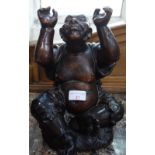 A CARVED WOODEN FIGURE OF AN ASIAN MAN with a long ponytail, arms aloft, signed Platreau Nantes,