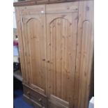 A REPRODUCTION PINE DOUBLE WARDROBE, 148cm wide