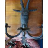 A LARGE PATINATED BRONZE THREE BRANCH WALL SCONCE in the form of a stag's head, 84cm high