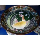 AN ORIENTAL CLOISONNE TRAY decorated with a stylized bird 31cm dia.