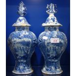 A PAIR OF DUTCH DELFT VASES AND COVERS CIRCA 1780 of flattened baluster form, the octagonal shaped