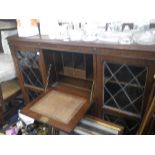 A 1920'S OAK SECRETAIRE BOOKCASE, a work table, a small cabinet, and a box of sundries