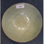 A CHINESE EARLY MING CELADON BOWL with decorated with leaves, 17.5cm dia