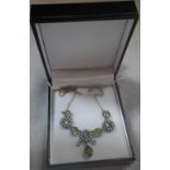 A PERIDOT SEED PEARL AND DIAMOND NECKLACE attached to a fine link chain, 41cm long