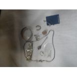 A SILVER 'THISTLE' PIN, A SILVER BANGLE, HORSESHOE CHARM and other silver items