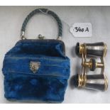 A PAIR OF OPERA GLASSES held in a velvet purse