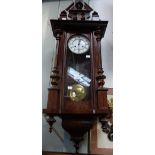 A VICTORIAN WALNUT CASED VIENNA STYLE WALL CLOCK