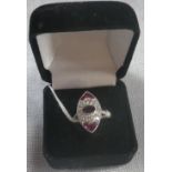 AN ART DECO STYLE RUBY AND DIAMOND DRESS RING, on a platinum shank, ring size N-O