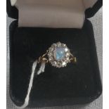 AN OPAL AND DIAMOND RING on an 18ct yellow gold shank, ring size M