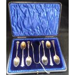 A SET OF SIX SILVER TEASPOONS AND TONGS, with gilt bowls, in a fitted presentation case