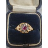 A 'RUBY' AND DIAMOND DRESS RING, on an 18ct yellow gold shank, ring size J