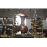 A PAIR OF 19TH CENTURY BRASS AND WOOD SHOE CHIMNEY ORNAMENTS, three pairs of brass candlesticks