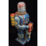 DAIYA; A VINTAGE JAPANESE TIN-PLATE BATTERY OPERATED SPACEMAN with back pack (for batteries) and
