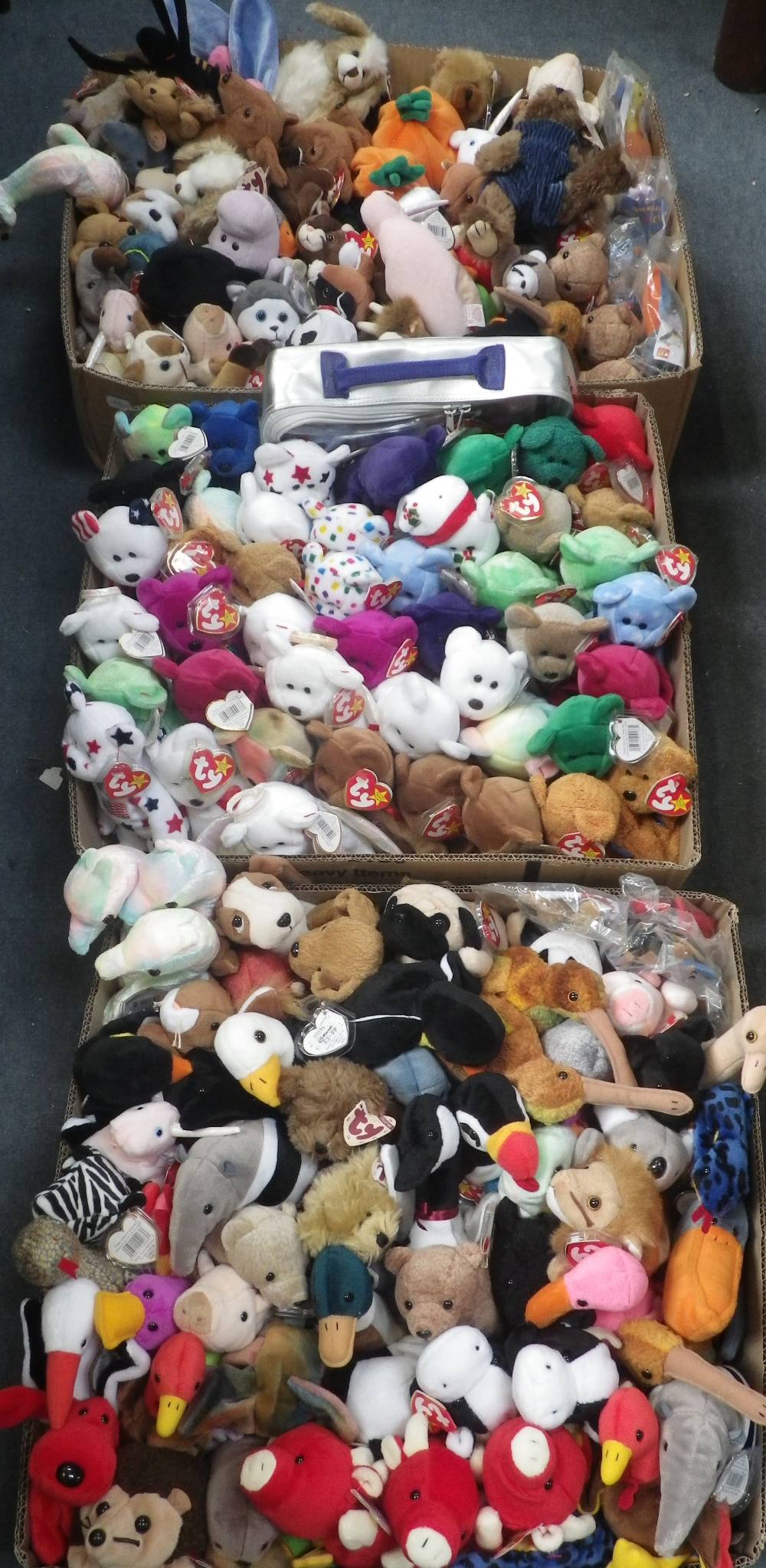 TY; A LARGE COLLECTION OF 'BEANIE BABIES' (three boxes)