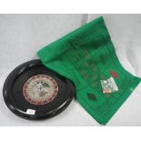 CHAD VALLEY; A VINTAGE BLACK BAKELITE ROULETTE WHEEL, 19cm dia and a green baize gaming mat with