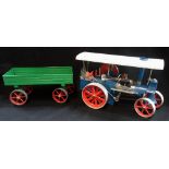 WILESCO; A STEAM TRACTION ENGINE, 'OLD SMOKEY' with blue paint work and a green trailer