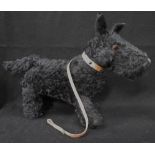 A VINTAGE 1950S PLUSH TOY SCOTTIE DOG with a studded leather collar and lead, 46cm long