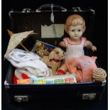 A VINTAGE BLUE CASE containing a Vintage plush dog, a doll, a Merit toddler's train and similar