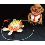 A VINTAGE TIN-PLATE 'MOBO TORTOISE' he walks, with a hand-activated mechanism, circa 1950s, "I leave