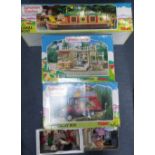 SYLVANIAN FAMILIES; A VILLAGE BAKERY, a canal boat and a country bus (all boxed) and loose items
