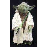 HASBRO; A STAR WARS BATTERY OPERATED YODA FIGURE with light sabre