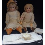 AN EARLY 20TH CENTURY BISQUE HEADED DOLL, stamped, ' 99 DEP GERMANY HANDWERCK 3' with a composite