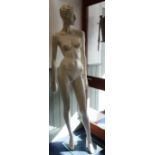 ROOTSTEIN: A CONTEMPORARY FEMALE MANNEQUIN in grey with a plate glass base, 181cm high