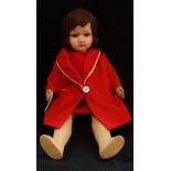 A 1930S COMPOSITE DOLL with a filled material body and original red coat, 46cm high