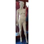 ROOTSTEIN: A CONTEMPORARY FEMALE MANNEQUIN in grey with a plate glass base, 181cm high