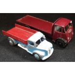 A DINKY TOYS 'GUY' FLATBED TRUCK and a Dodge tipper truck (2)