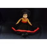 A VINTAGE NORAH WELLINGS DOLL with a painted face and velvet body, 52cm high