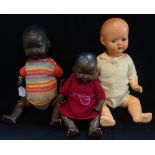 A VINTAGE COMPOSITE DOLL, with jointed limbs and two black dolls (3)