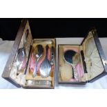 A SILVER BACKED DRESSING SET in a fitted box and another similar(2)