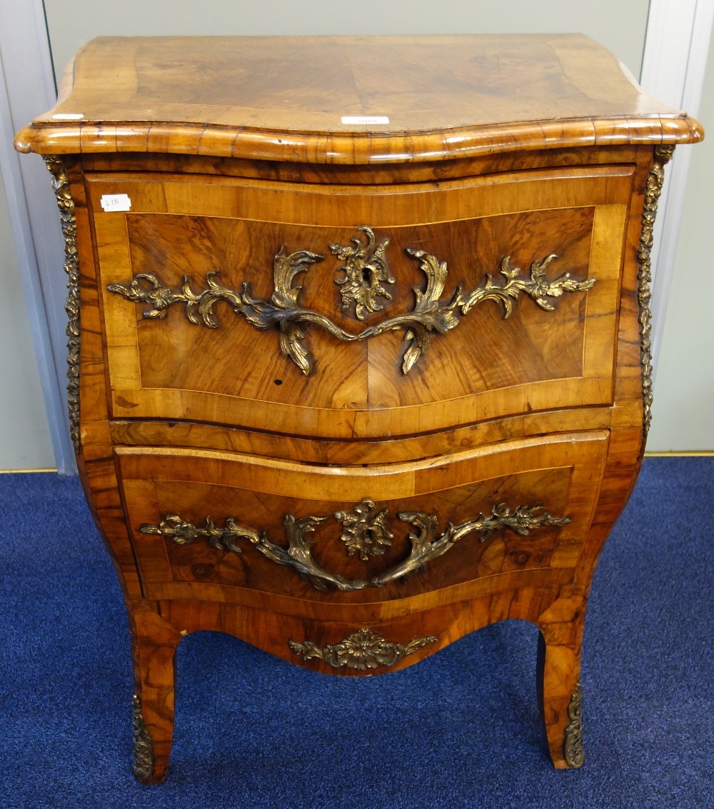 A 19TH CENTURY FRENCH STYLE BOMBE FRONTED CHEST of two drawers, with ormolu mounts and handles,