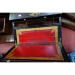 A LARGE REGENCY BRASS INLAID ROSEWOOD WRITING SLOPE, opening to reveal a red and gilt leather