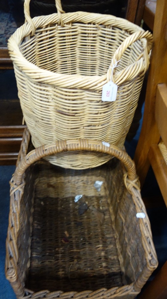 A RECTANGULAR WICKER LOG CARRYING BASKET and another log basket