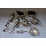 AN EXTENSIVE SILVER CRUET and an embossed spoon