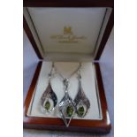 A SILVER AND "PERIDOT" PENDANT, on a fine link chain, with en suite earrings