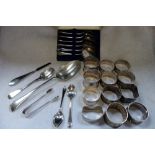 A SET OF SIX SILVER TEA SPOONS, silver spoons, silver napkin rings and similar
