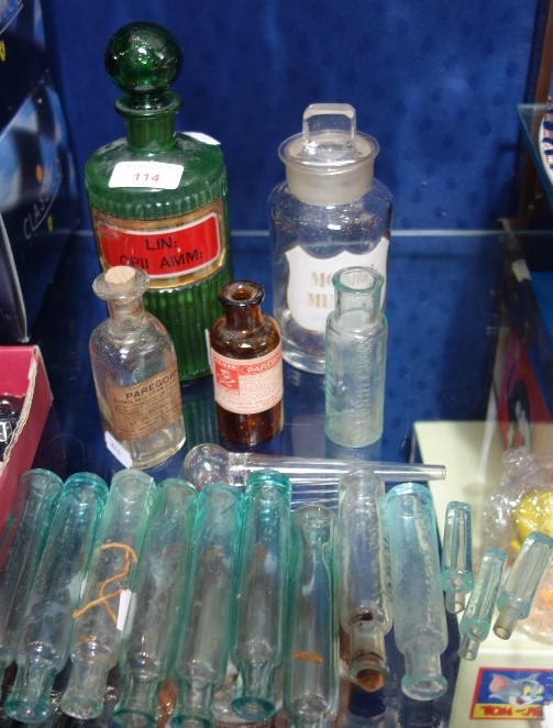 A GREEN GLASS CHEMIST'S BOTTLE, 'LIN: OPII AMM:' and similar bottles