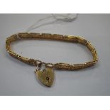 A 9CT GOLD GATE LINK BRACELET, with padlock clasp, approx. 12grams
