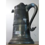 A LARGE PEWTER LIDDED FLAGON, the handle with heart shaped terminal, 32cm high