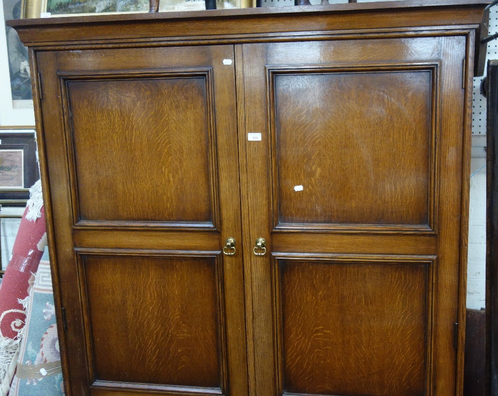 A LARGE OAK DOUBLE WARDROBE and a collection of wall mirrors