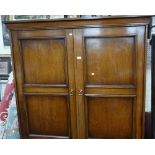 A LARGE OAK DOUBLE WARDROBE and a collection of wall mirrors